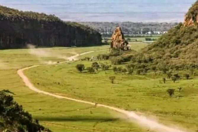 Private Day tour to Hell's Gate National Park and Lake Naivasha - Cycling beneath the Hells Gate cliffs